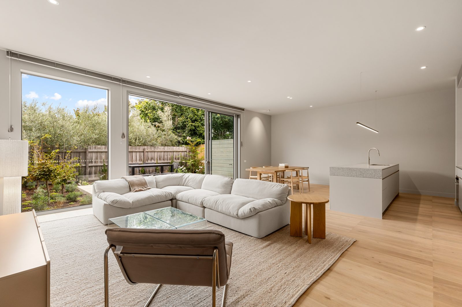 Open-plan living area at AlmaLuxe with natural light